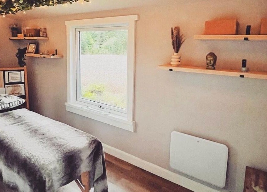 Therapy room at Breathe and Bloom Holistics, Wakefield, England, GB. Serene setting with massage table and decor.