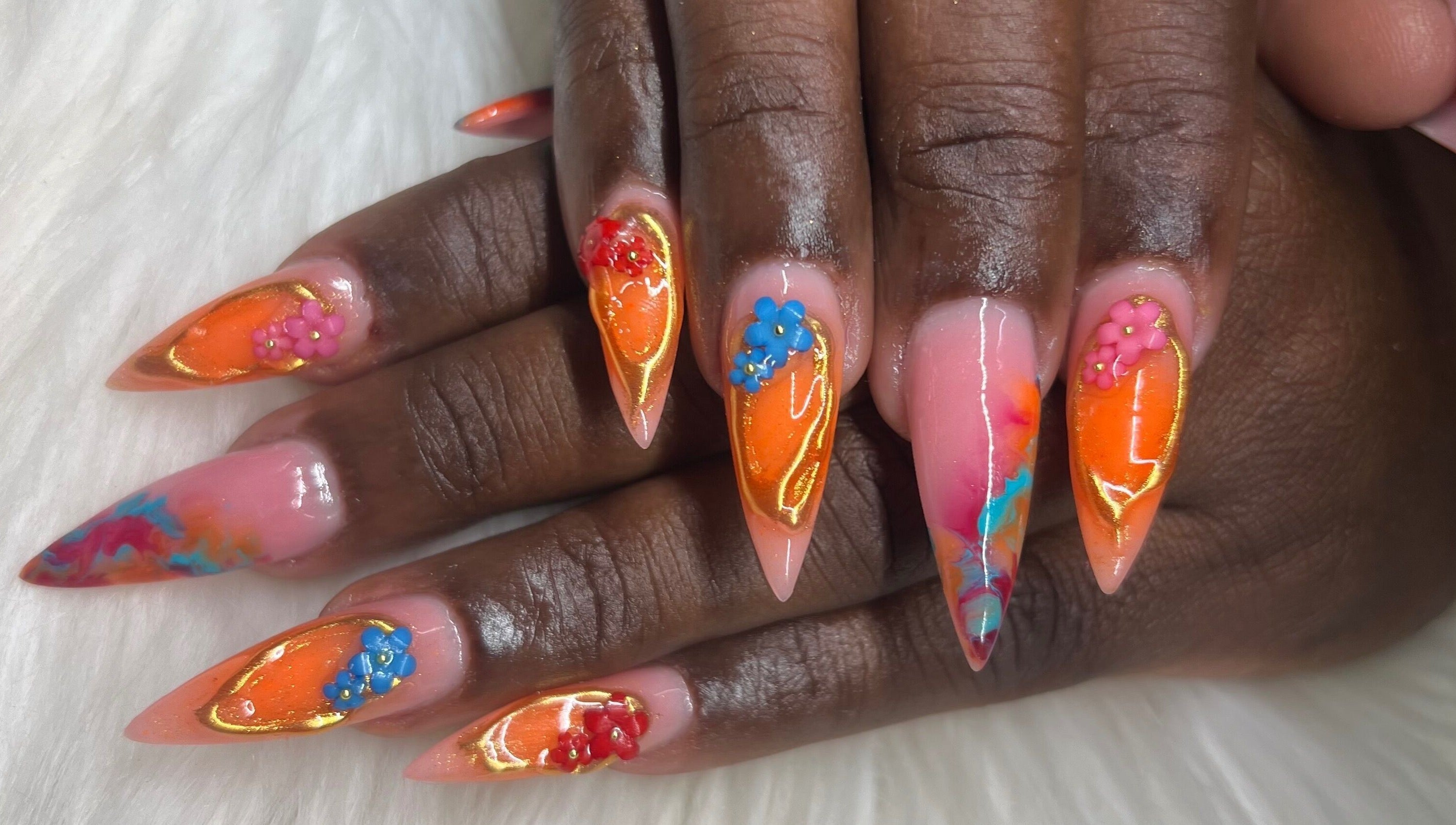 Vibrant floral nail art at The Nail & Lash Studio, Saint Philip, BB. Showcases exquisite design on manicured nails.