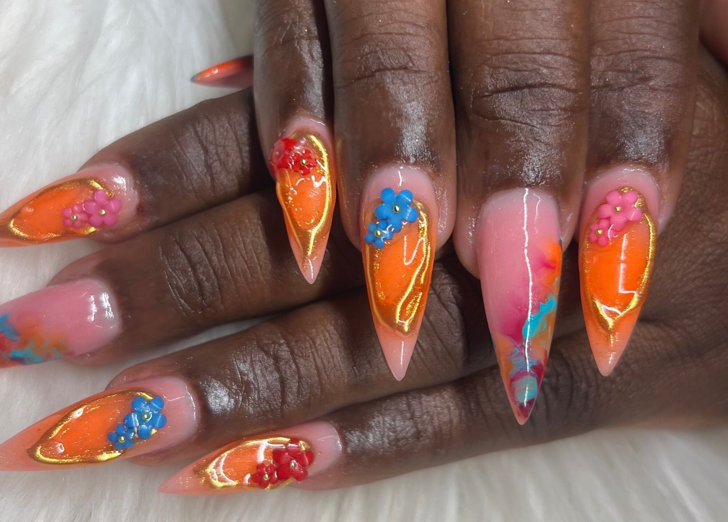 Vibrant floral nail art at The Nail & Lash Studio, Saint Philip, BB. Showcases exquisite design on manicured nails.