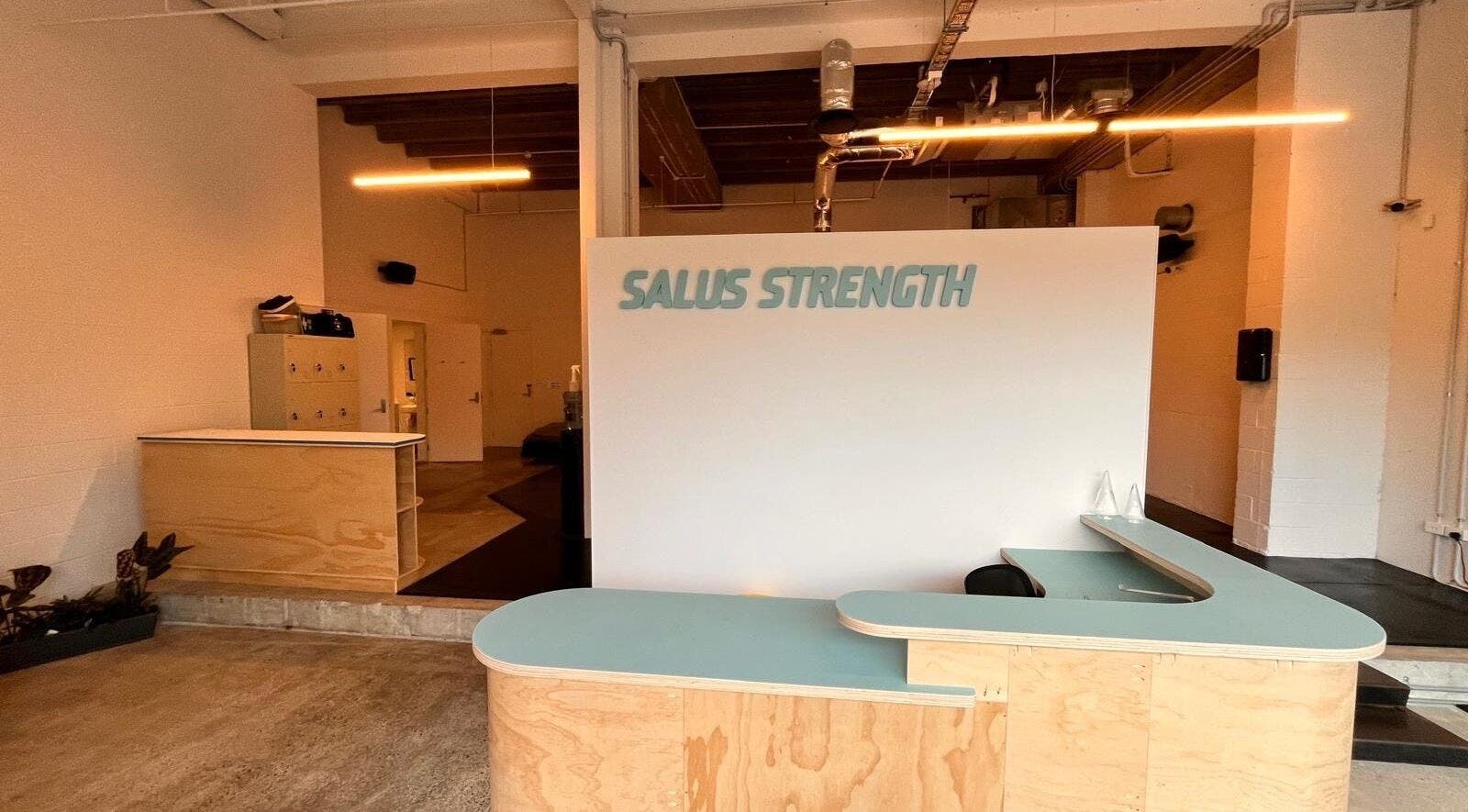 Reception area of Salus Strength in Auckland, Auckland, NZ featuring modern wood decor and sleek design.