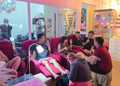 Guests enjoying a relaxing time at The Beauty Pro in Puerto Princesa, Mimaropa, PH with vibrant decor.