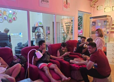 Guests enjoying relaxing treatments at The Beauty Pro, Puerto Princesa, Mimaropa, PH in a cozy lounge setting.