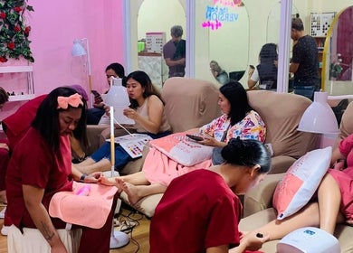 Customers enjoying a relaxing nail service at The Beauty Pro, Puerto Princesa, Mimaropa, PH in a cozy setting.