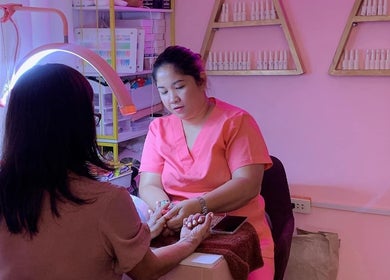 A nail technician at The Beauty Pro, Puerto Princesa, Mimaropa, PH, provides a relaxing manicure service.