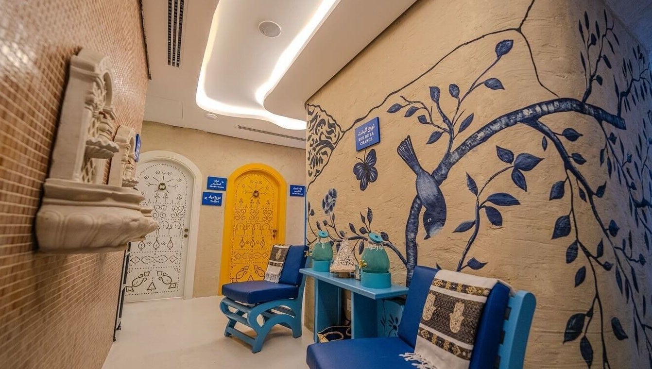 Beautifully decorated hallway at LYA Spa & Salon, Riyadh, Riyadh Province, SA, featuring artistic wall murals.