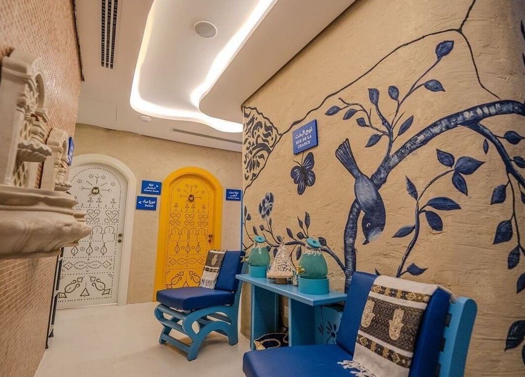 Beautifully decorated hallway at LYA Spa & Salon, Riyadh, Riyadh Province, SA, featuring artistic wall murals.