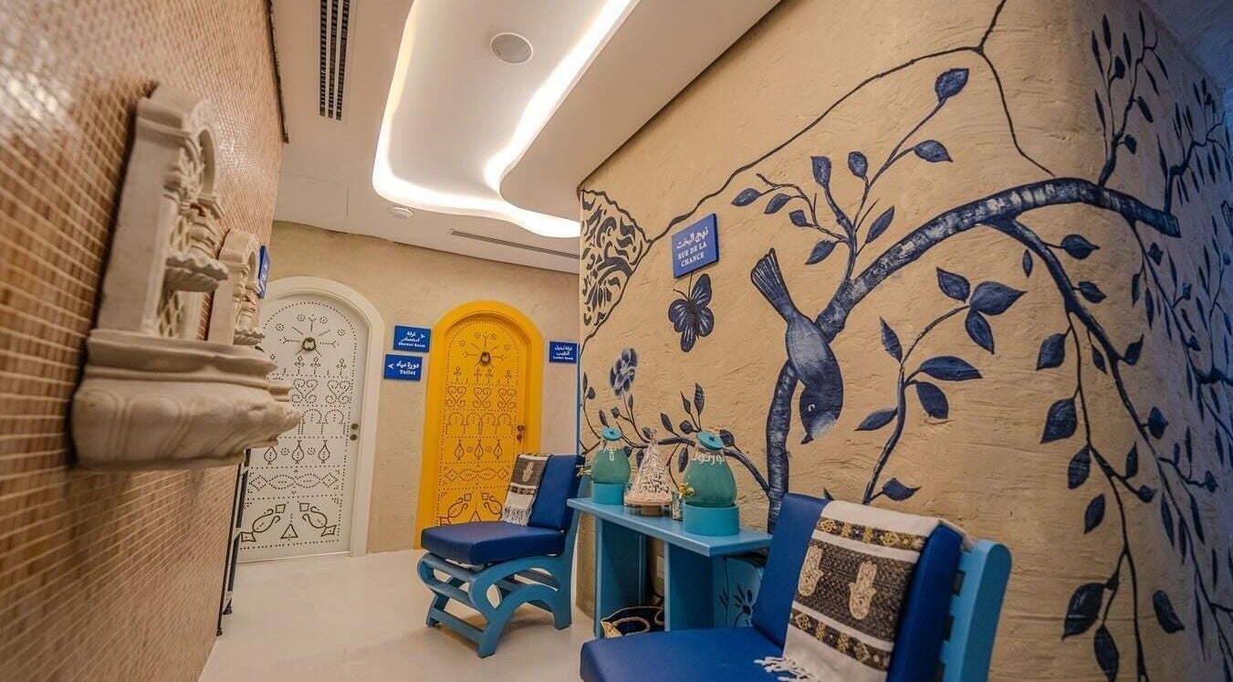 Beautifully decorated hallway at LYA Spa & Salon, Riyadh, Riyadh Province, SA, featuring artistic wall murals.