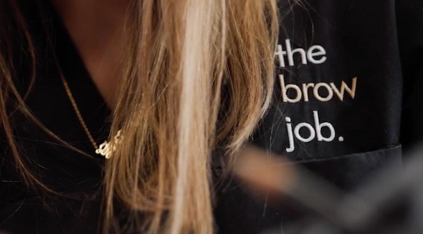 Logo on uniform at the brow job, Chester, England, GB showcasing branding.