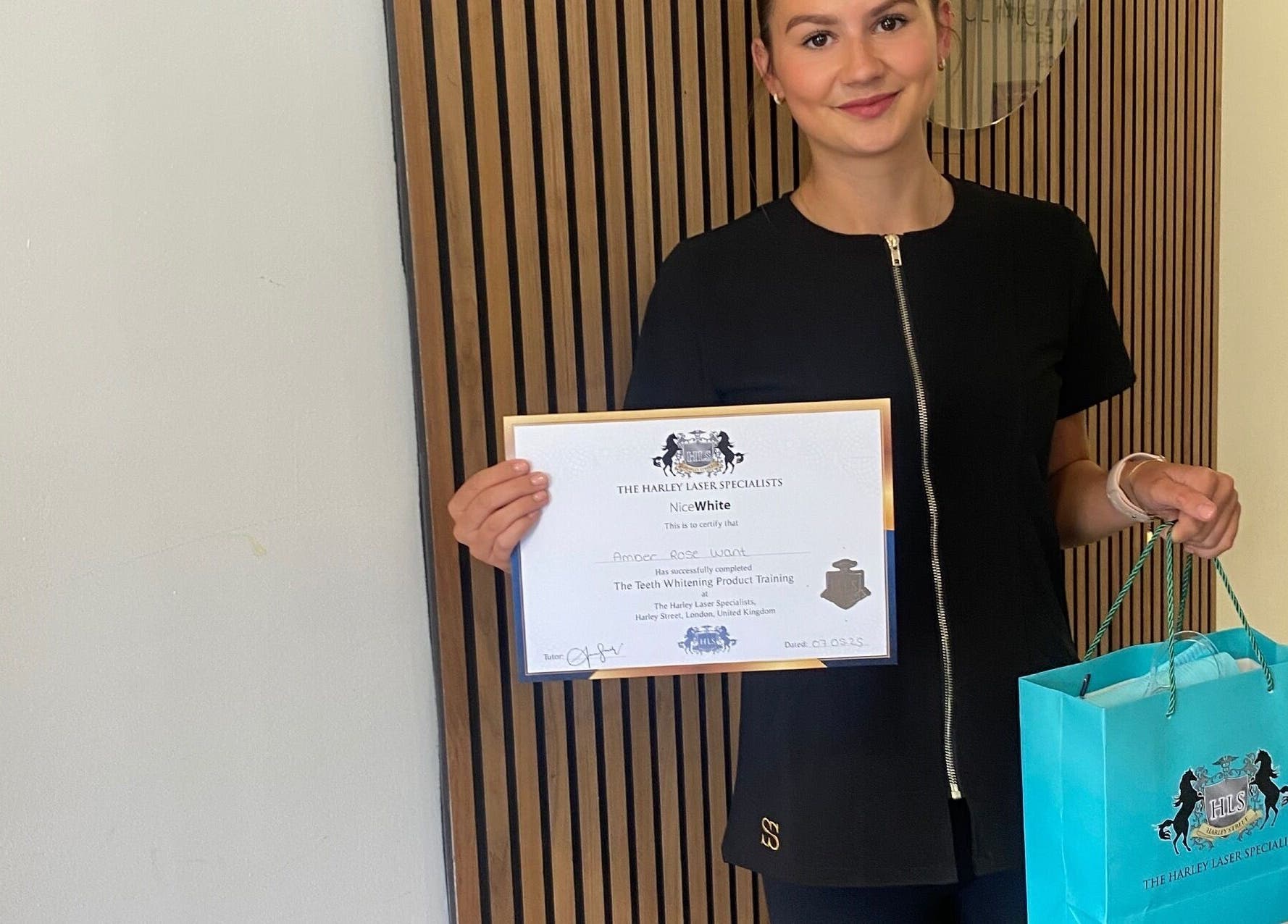 Amber Rose Beauty professional with certificate, Poole, England, GB, showcasing achievement.