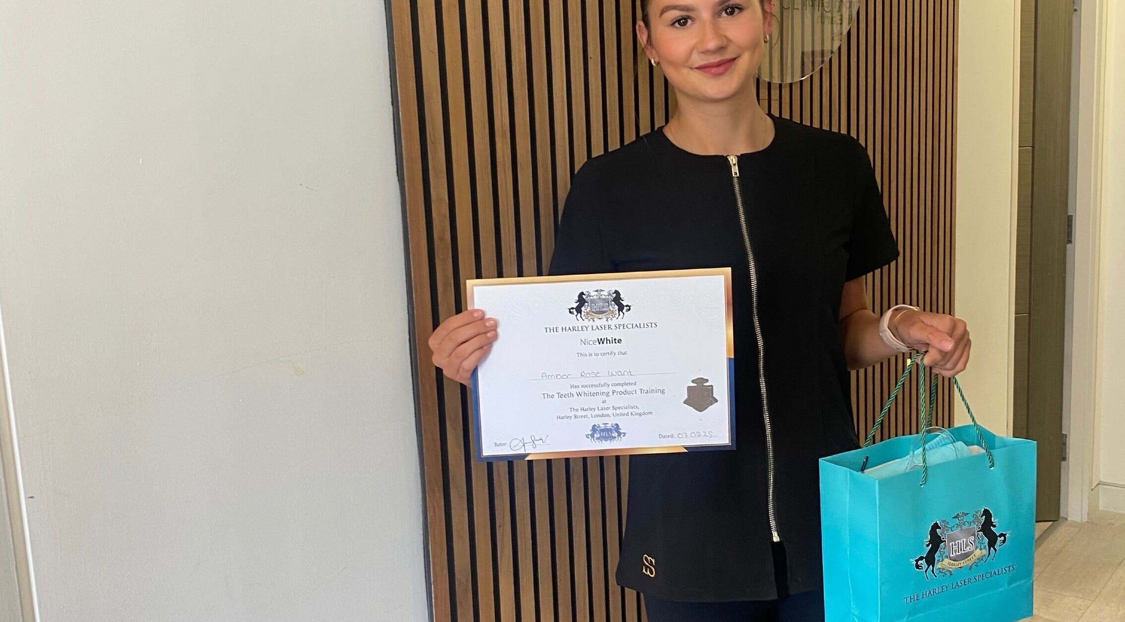 Amber Rose Beauty professional with certificate, Poole, England, GB, showcasing achievement.