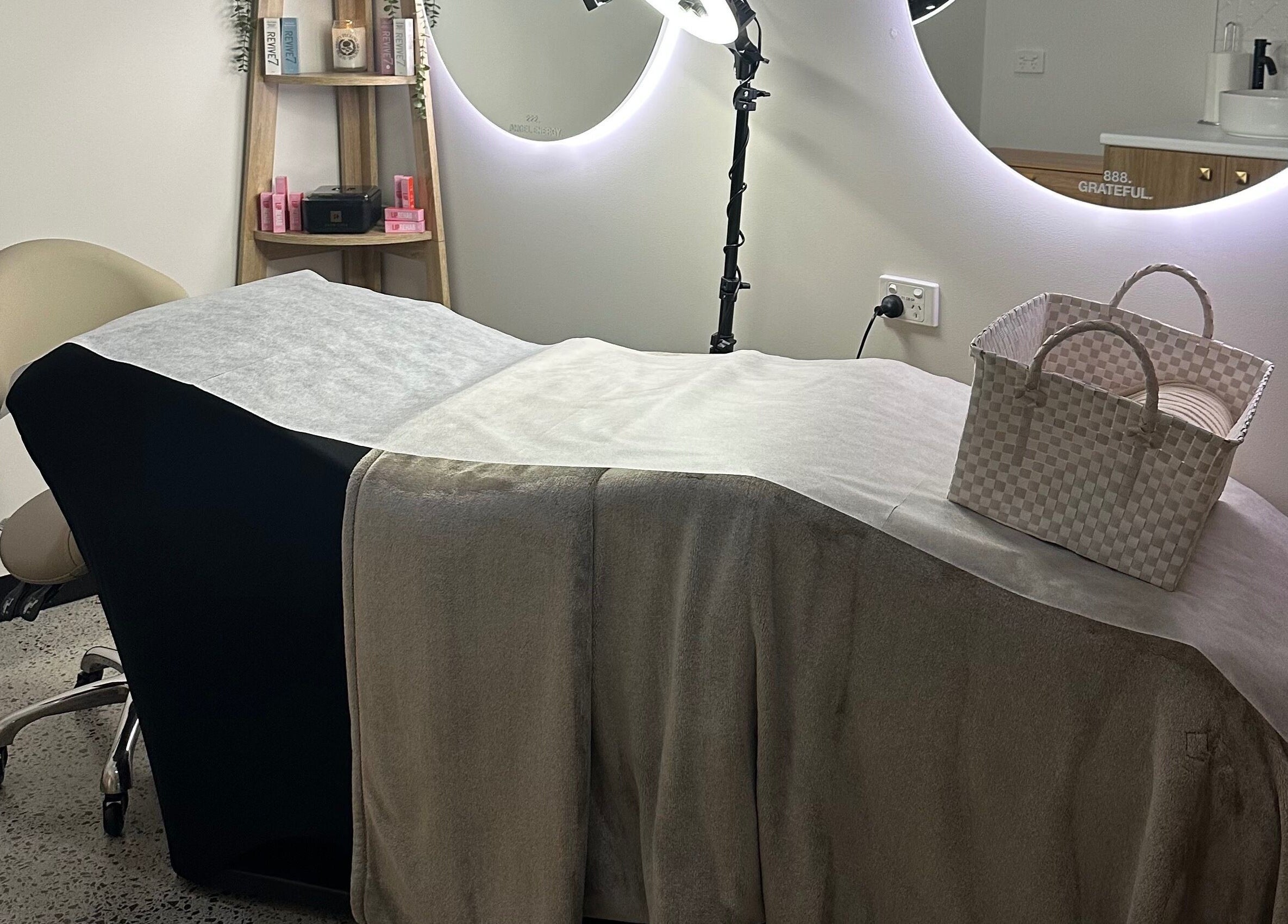 Luxurious treatment room at Ivory Rose Cosmetics in Maroochydore, Queensland, AU, featuring a comfortable spa bed.