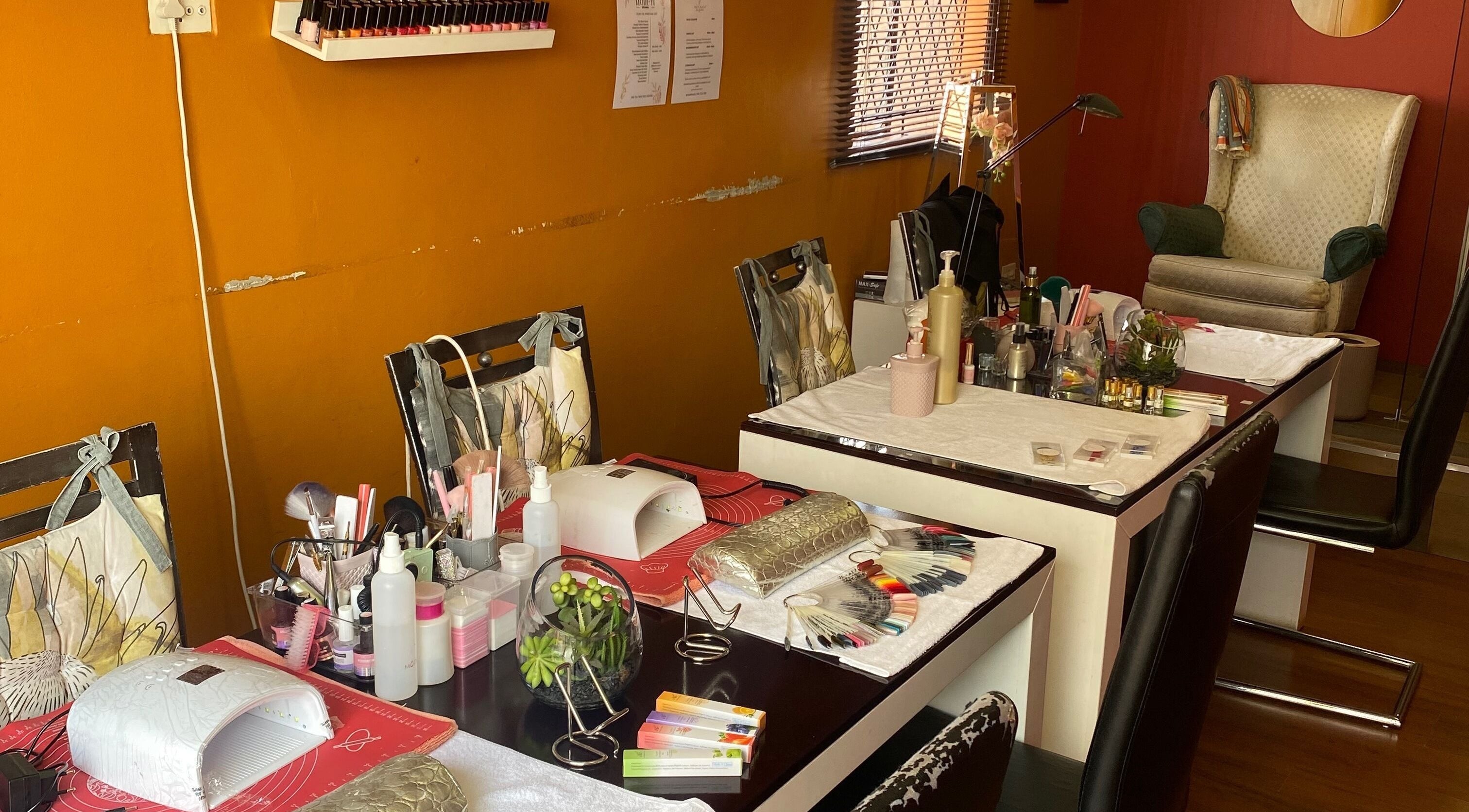 Cozy nail spaces at Modi Fi Nail And Beauty Bar, Soweto, Gauteng, ZA with manicure tools and polishes.