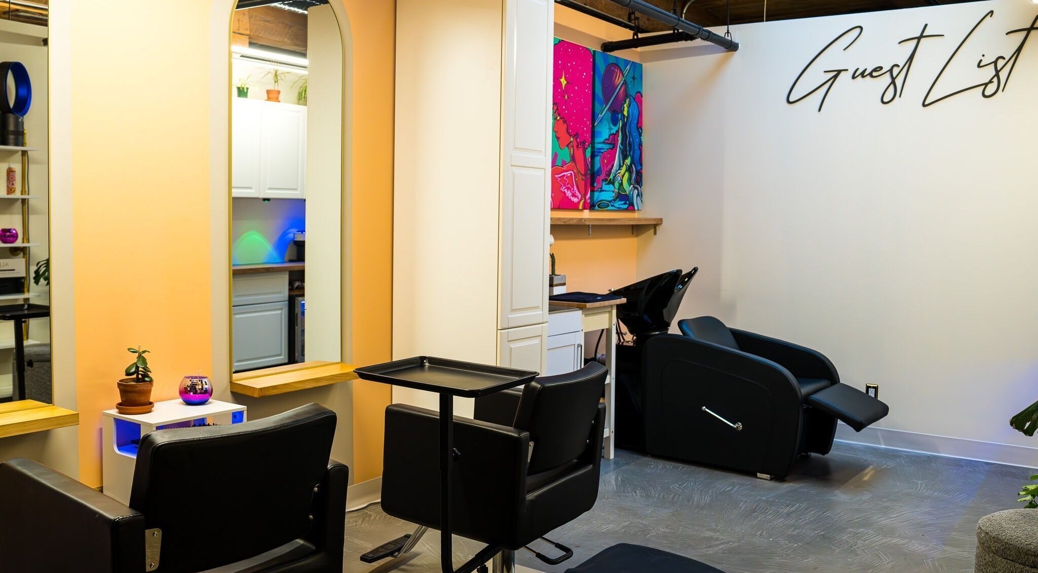 Modern hair salon interior at Guest List in Vancouver, British Columbia, CA with chic design and comfortable seating.