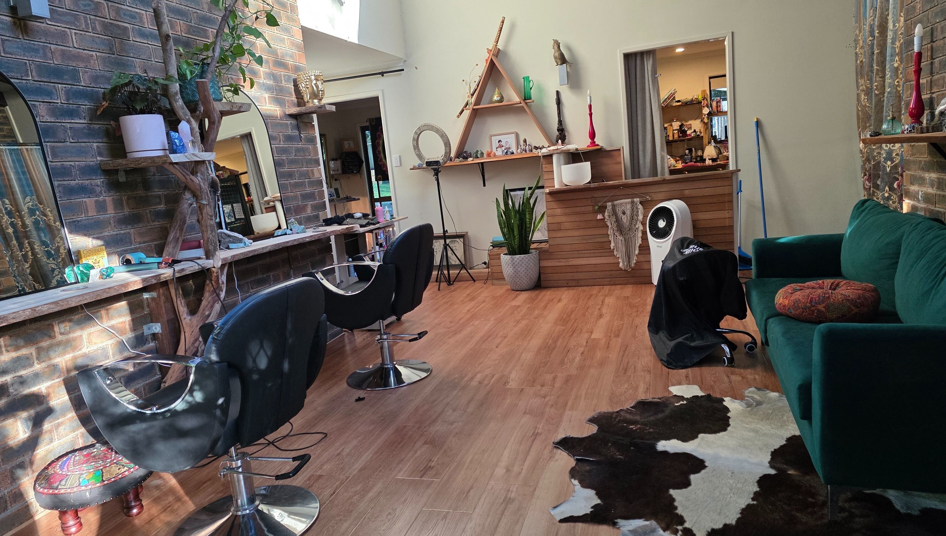 Trendy interior of Nest Hair salon, Shailer Park, Queensland, AU with stylish decor and seating.