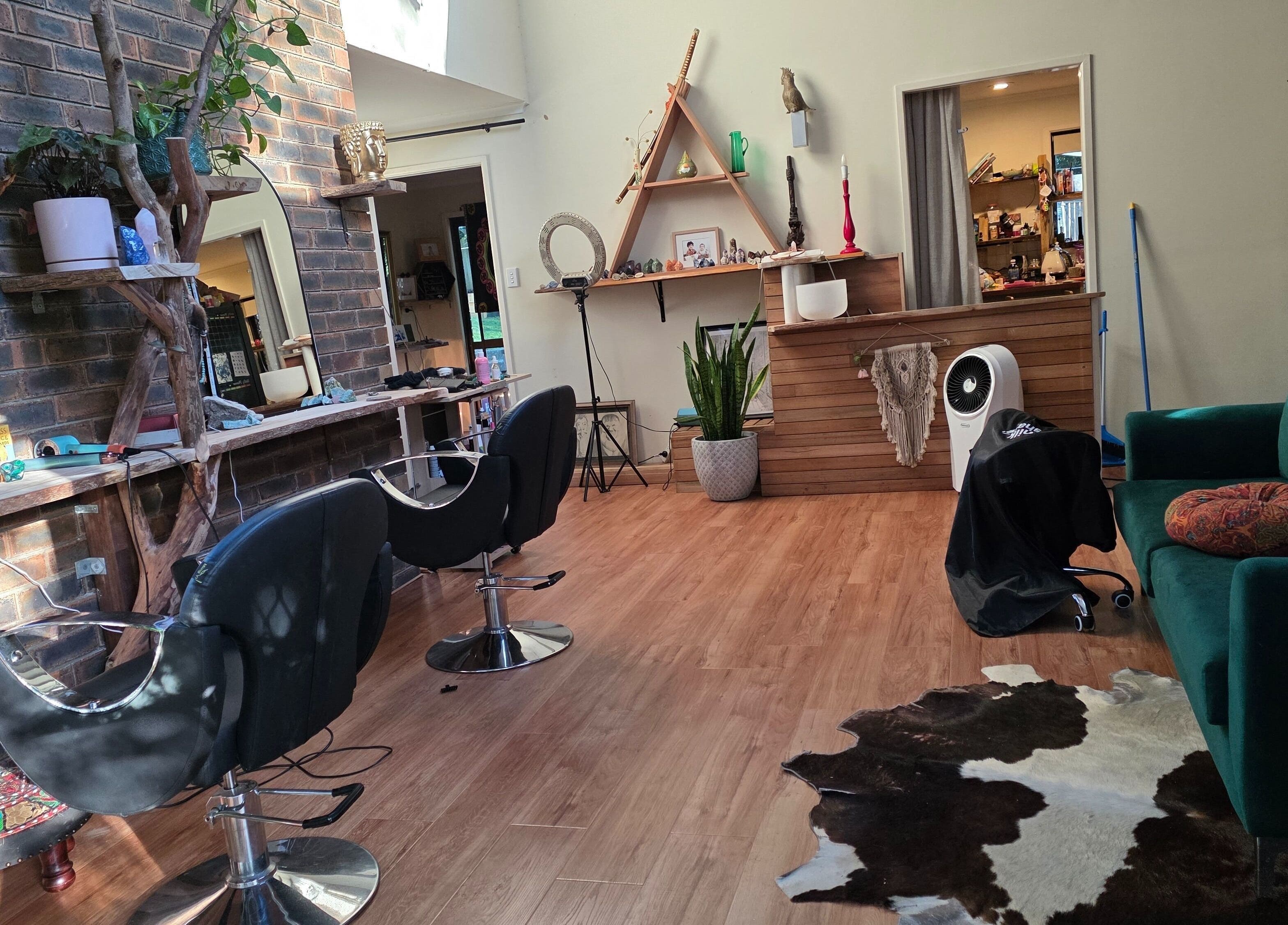 Trendy interior of Nest Hair salon, Shailer Park, Queensland, AU with stylish decor and seating.