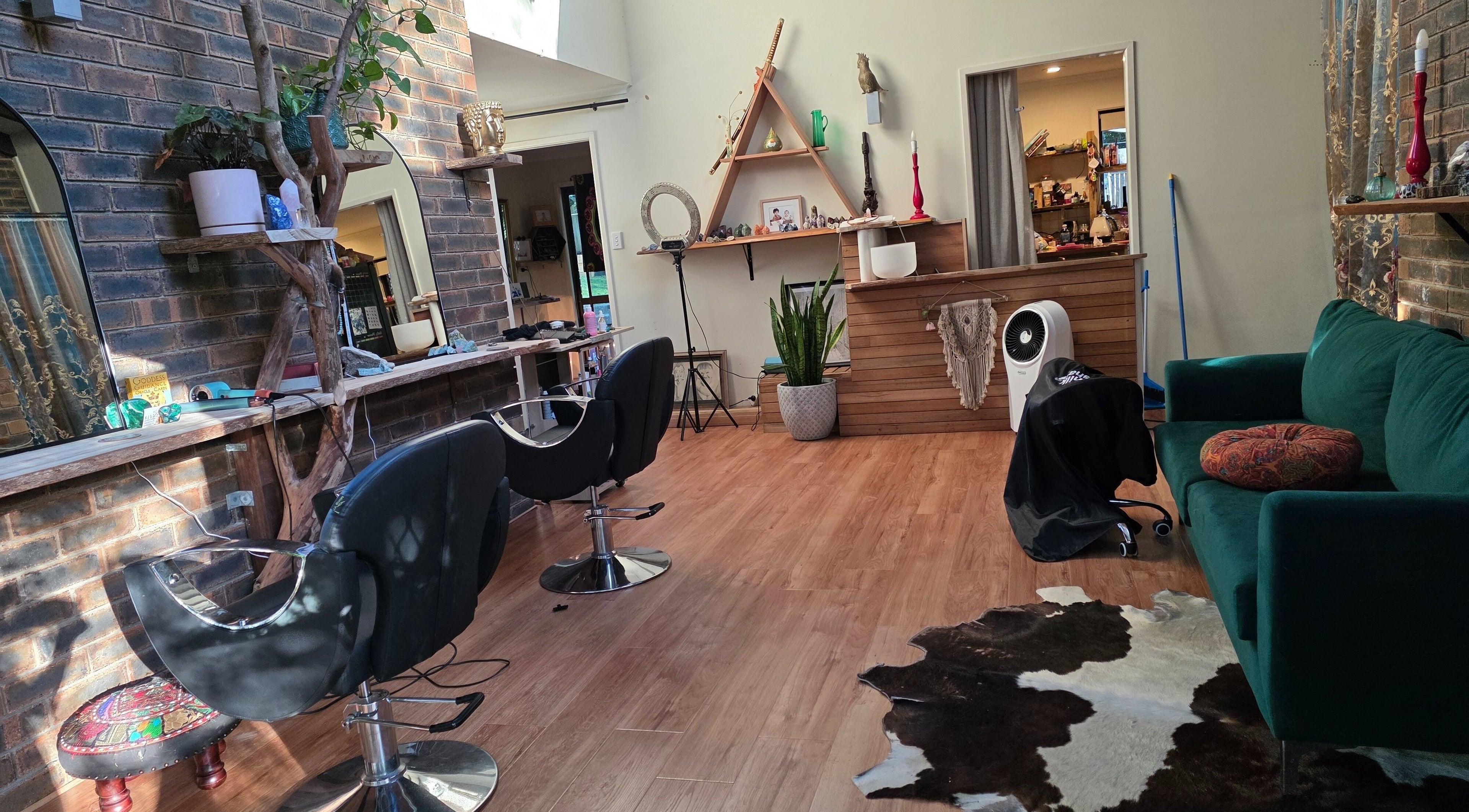 Trendy interior of Nest Hair salon, Shailer Park, Queensland, AU with stylish decor and seating.