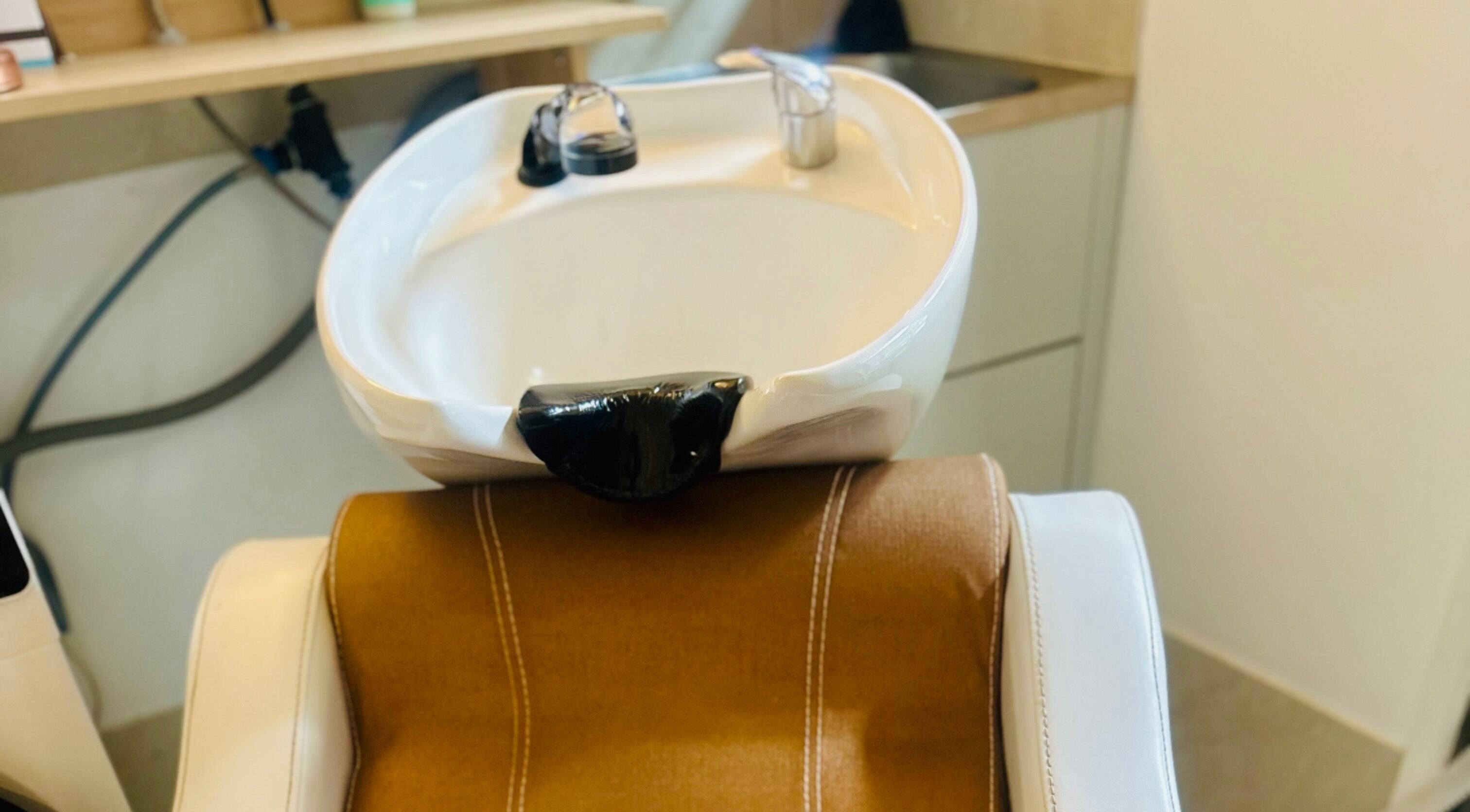 Modern hair wash station at Nest Hair, Shailer Park, Queensland, AU, featuring sleek and comfortable design.