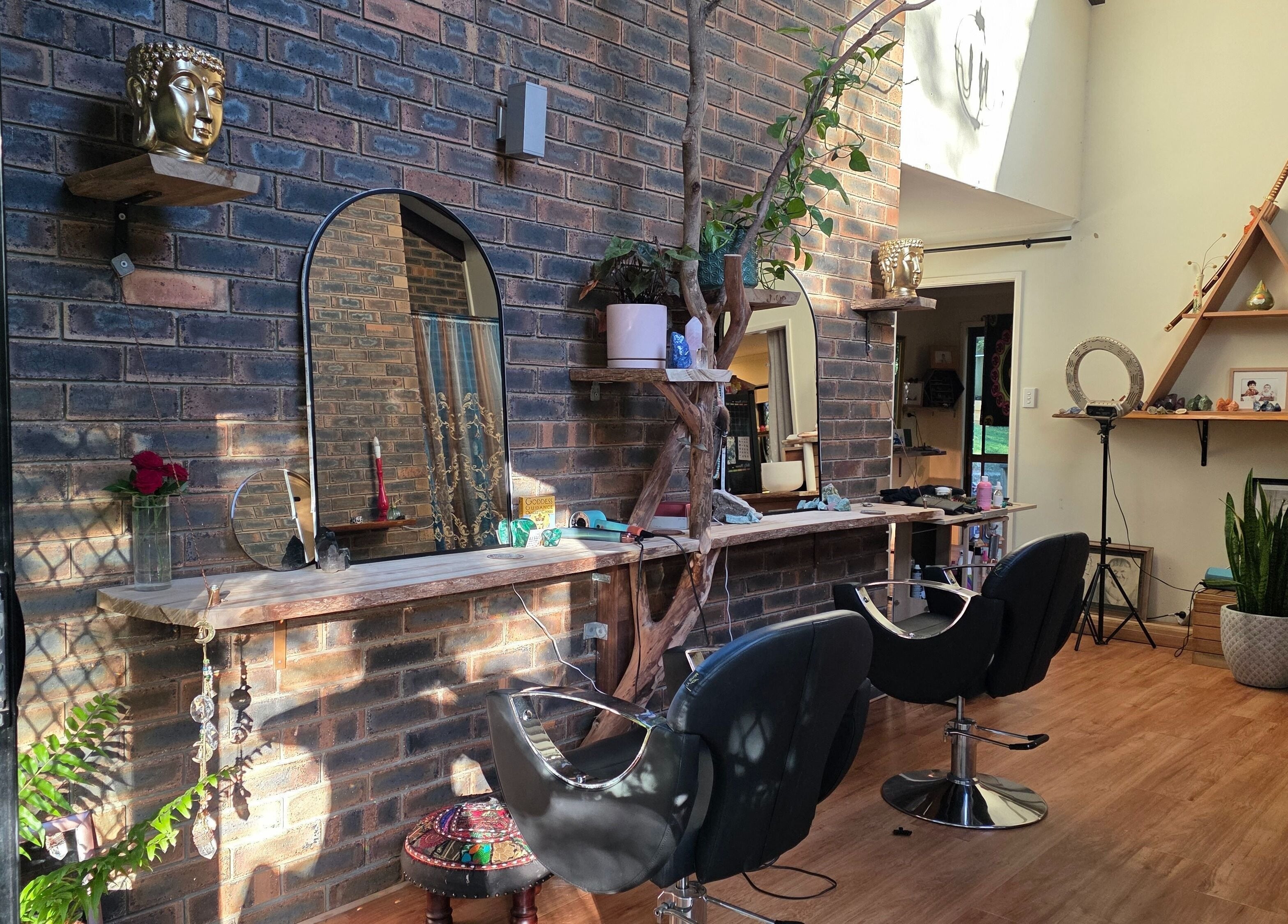 Chic interior of Nest Hair in Shailer Park, Queensland, AU with rustic decor and stylish salon chairs.