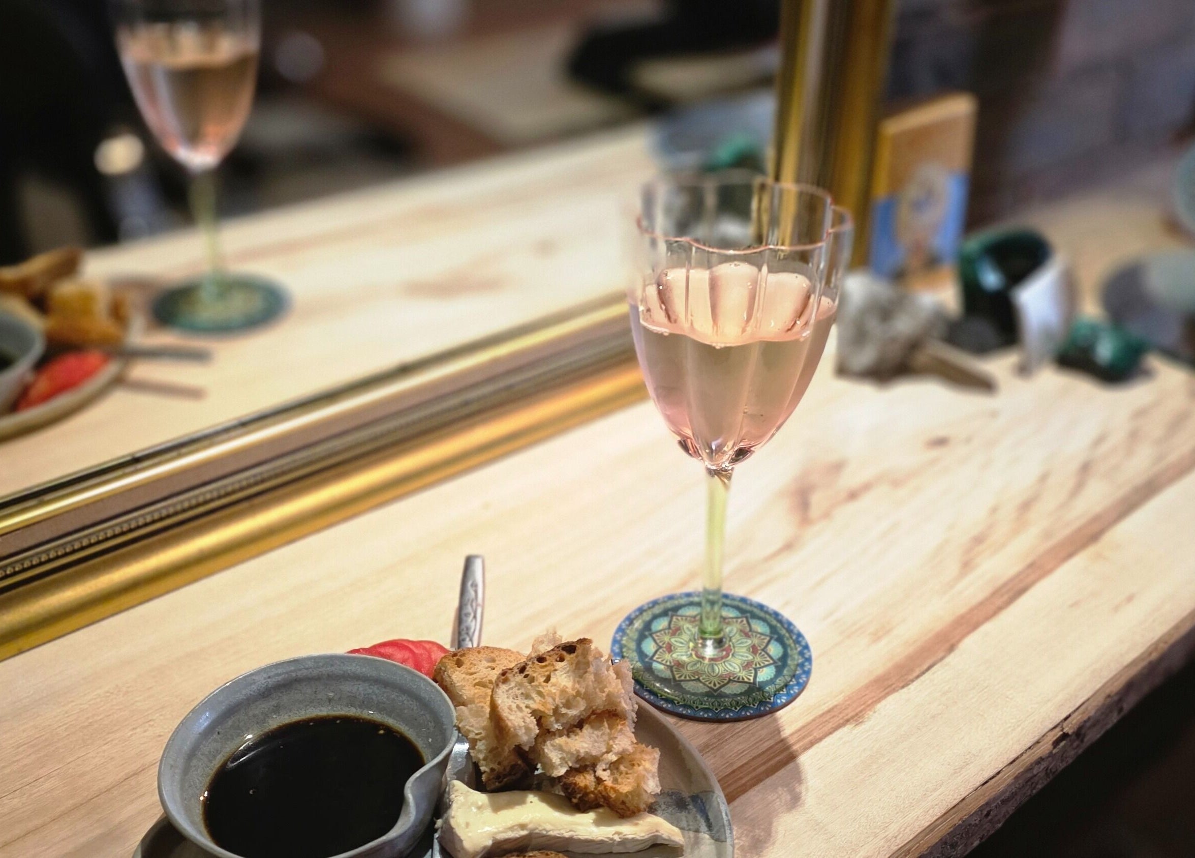 A cozy setting with wine and snacks at Nest Hair, Shailer Park, Queensland, AU.