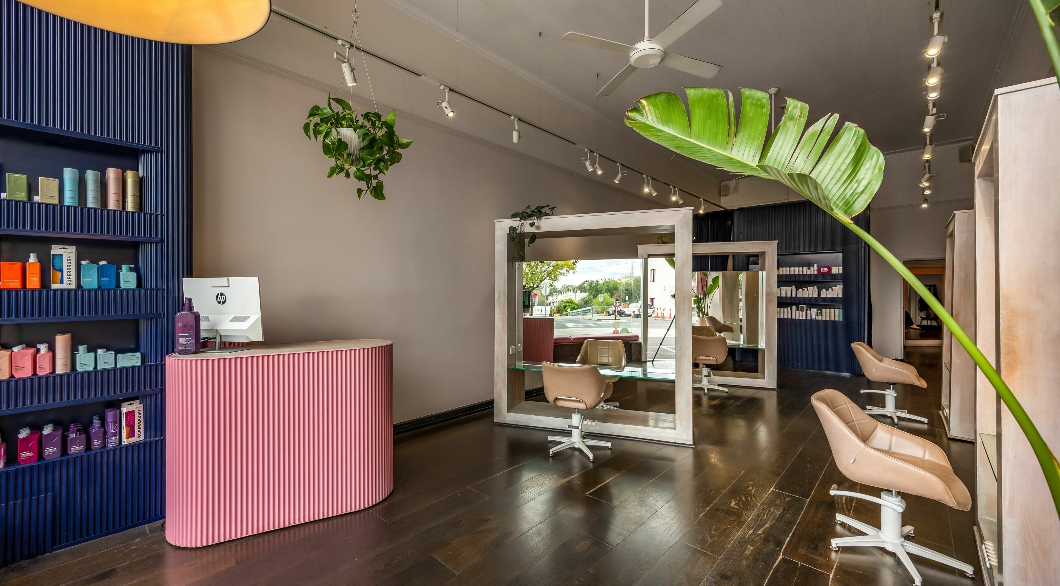 Stylish interior of Three Blind Mice salon in Melbourne, Victoria, AU featuring modern chairs and sleek decor.