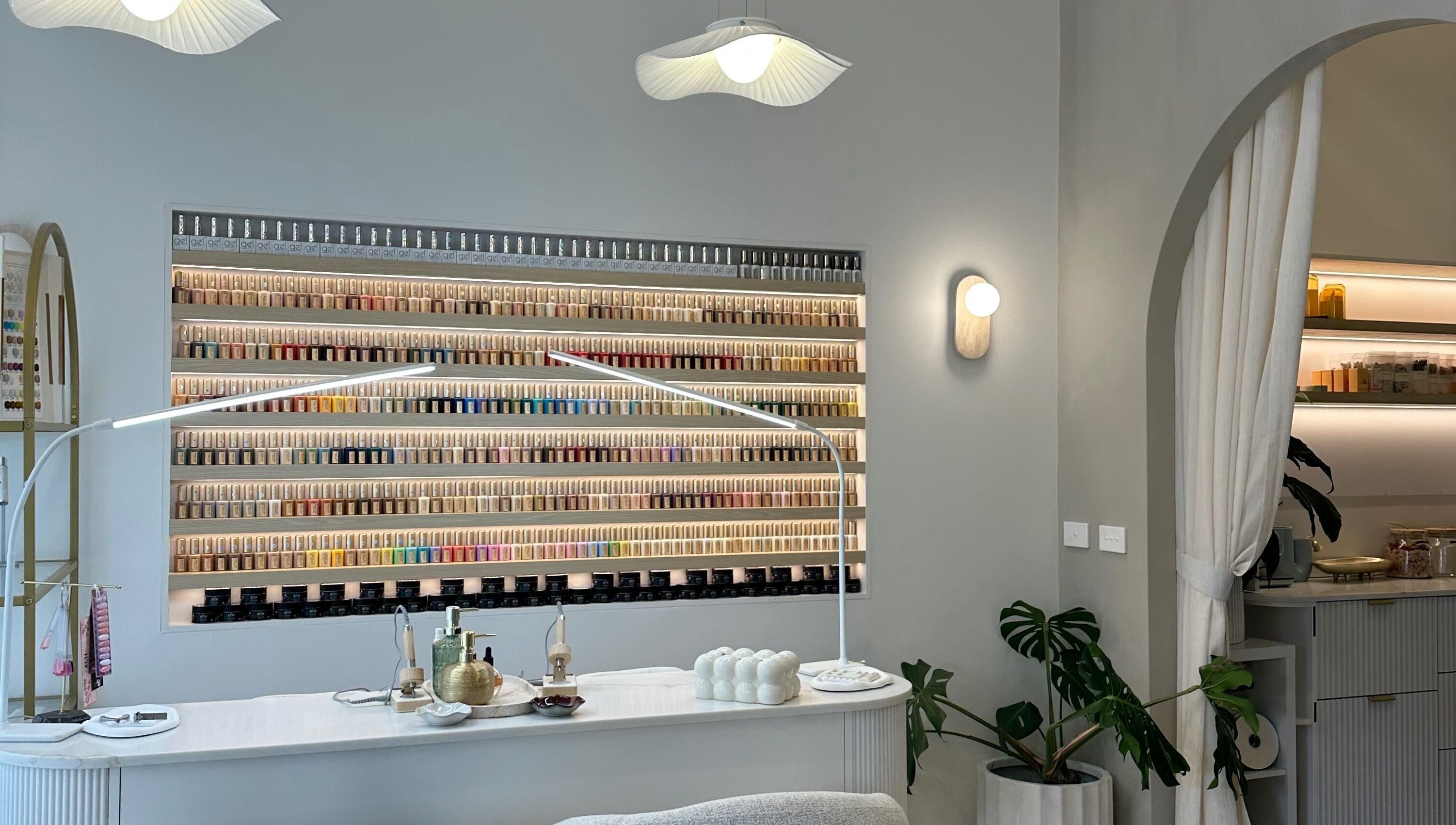 The Lux Cocoon in Newtown, Victoria, AU offers a serene manicure area with extensive nail polish display.