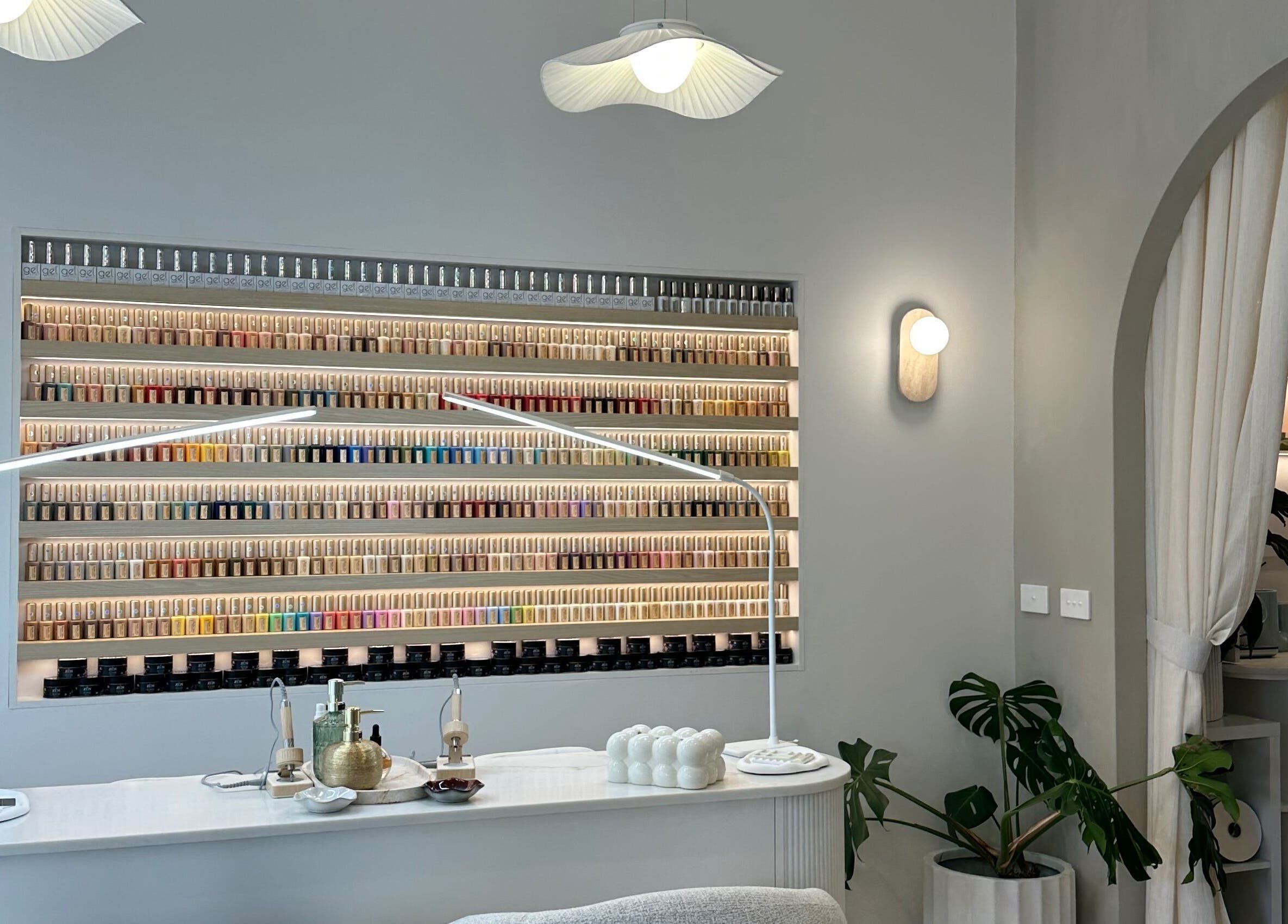 The Lux Cocoon in Newtown, Victoria, AU offers a serene manicure area with extensive nail polish display.