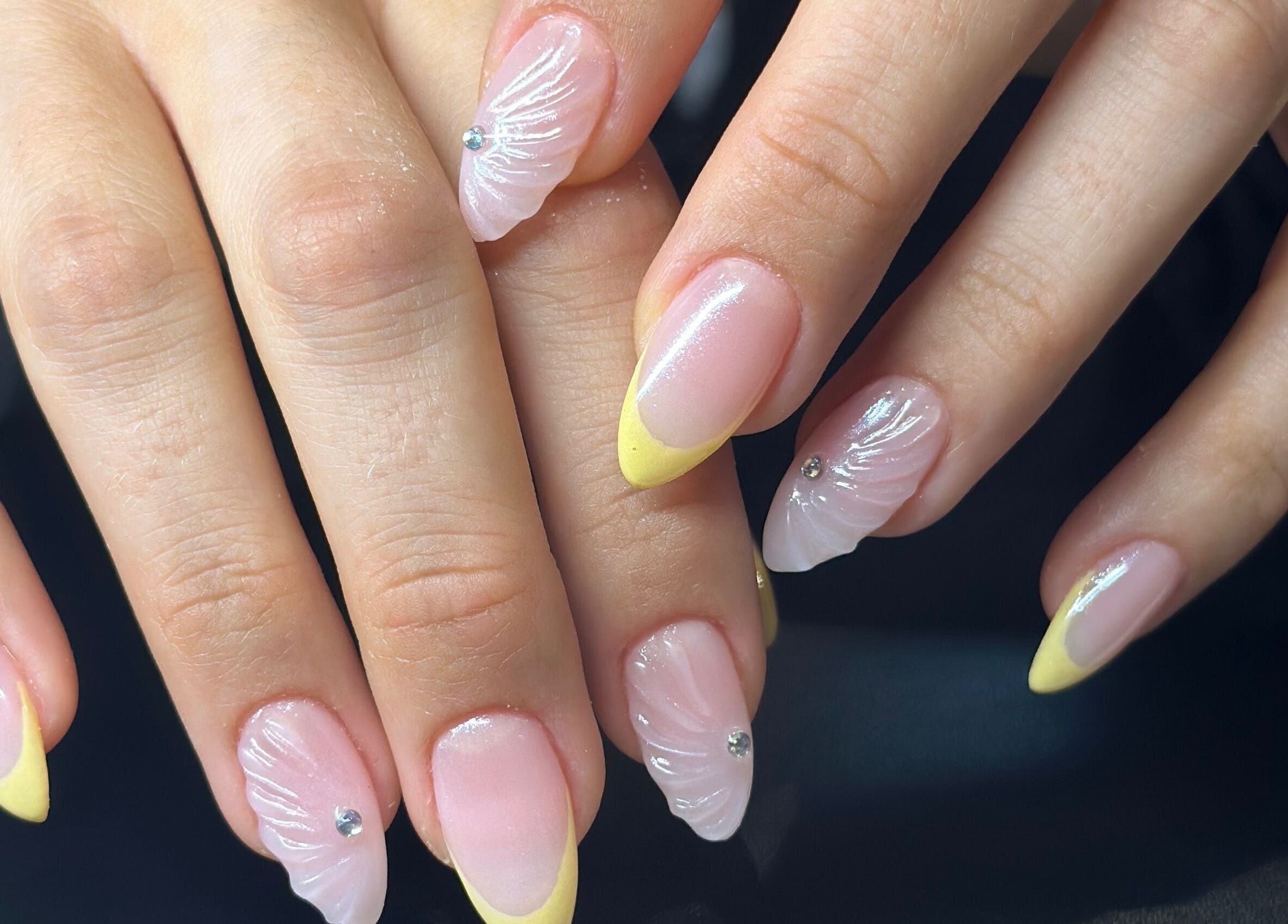 Stylish manicured nails at The Lux Cocoon in Newtown, Victoria, AU, featuring intricate nail art designs.