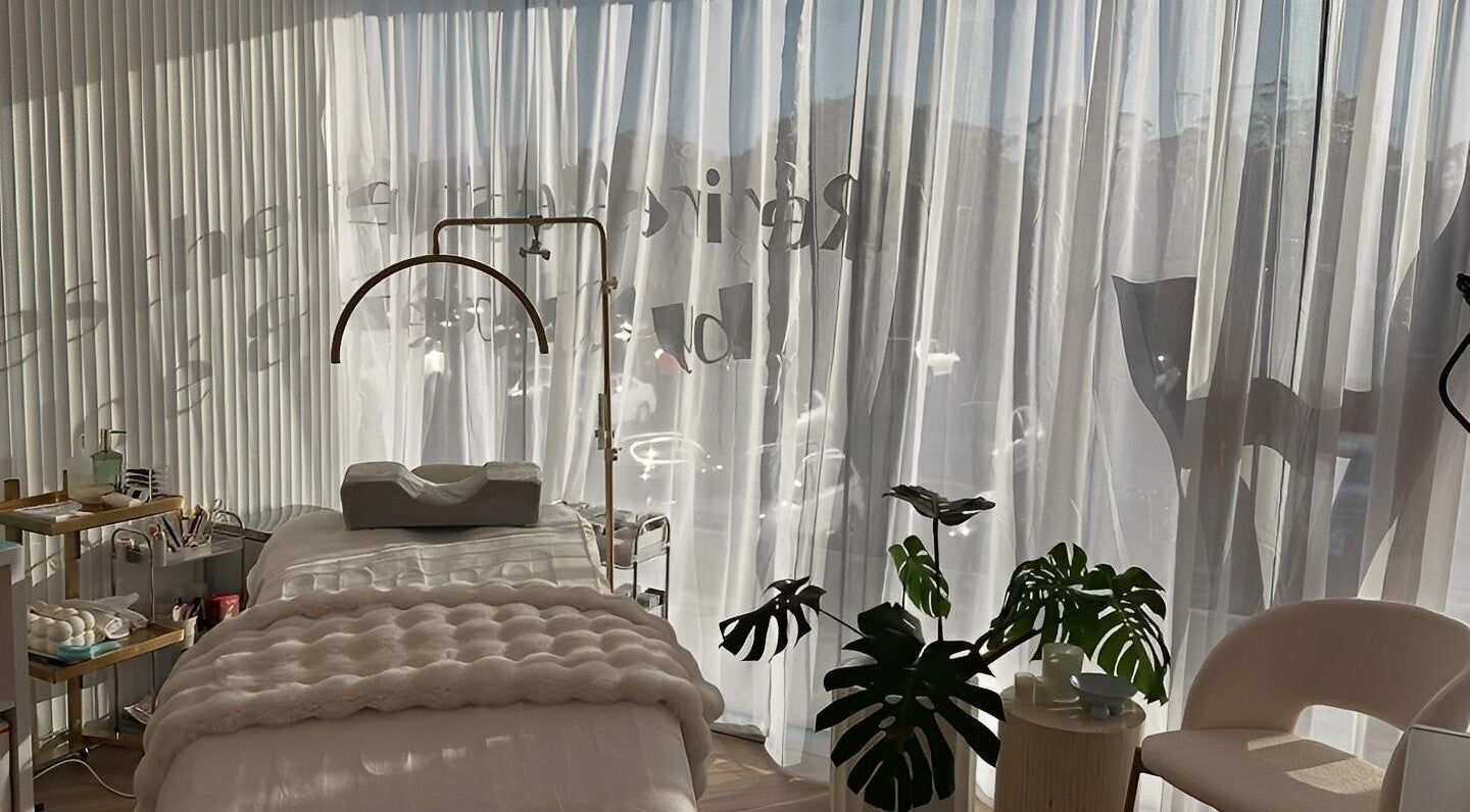 Elegant treatment room at The Lux Cocoon, Newtown, Victoria, AU, featuring soft light and lush decor.