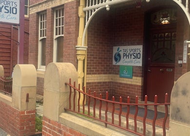 Entrance to Hobart Massage Guru, showcasing a red brick facade in Hobart, Tasmania, AU.