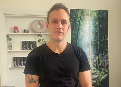 Relaxing interior of Hobart Massage Guru in Hobart, Tasmania, AU with serene decor and wellness books.