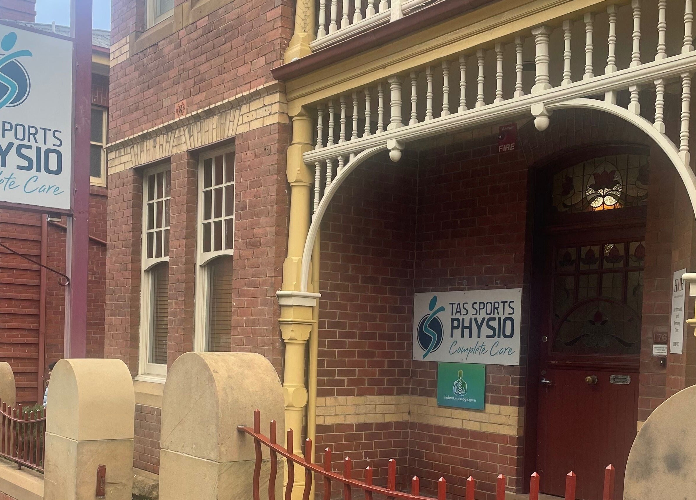 Entrance of Hobart Massage Guru in Hobart, Tasmania, AU, showcasing vintage brick architecture.