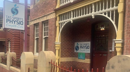 Entrance of Hobart Massage Guru in Hobart, Tasmania, AU, showcasing vintage brick architecture.