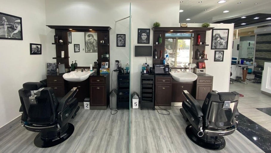 Interior view of Nazih Gents Salon - Sharjah showcasing sleek barber chairs and stylish decor in Sharjah, Sharjah, AE.