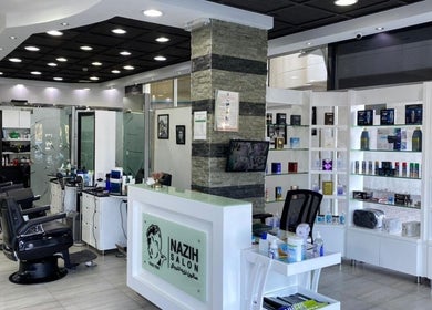 Modern interior of Nazih Gents Salon - Sharjah, showcasing stylish decor and grooming stations. Located in Sharjah, AE.