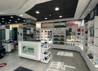 Interior of Nazih Gents Salon - Sharjah featuring styling stations and product displays, Sharjah, Sharjah, AE.