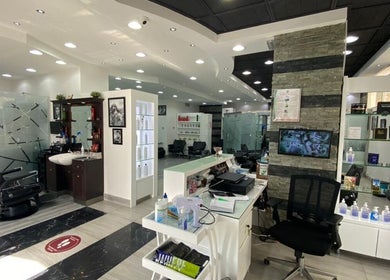 Modern interior of Nazih Gents Salon - Sharjah with sleek chairs and decor, located in Sharjah, Sharjah, AE.