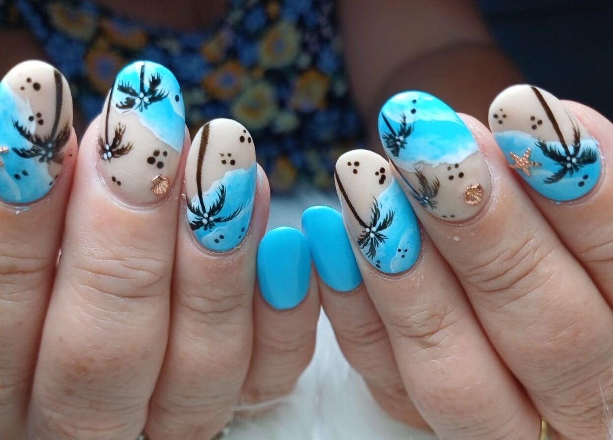 Vibrant tropical nail art by Beauty by Cherise in Cape Town, Western Cape, ZA featuring palm trees and ocean themes.