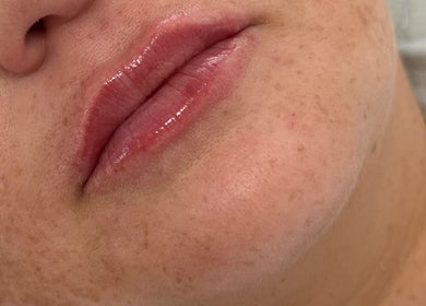 Close-up of glossy lips and smooth skin at J Ludusan Beauty, Dublin, County Dublin, IE.
