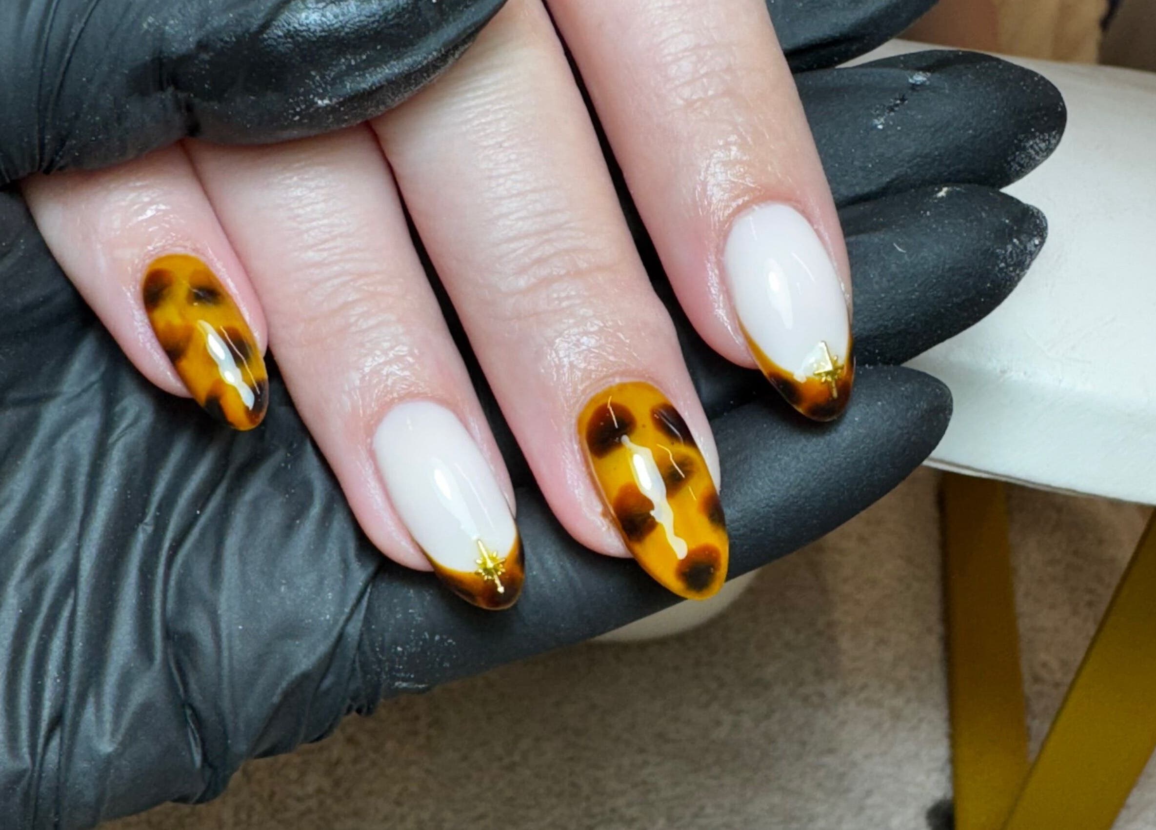 Tortoiseshell nail art at Glossy by Nieve, Hartlepool, England, GB. Intricate design crafted with precision.