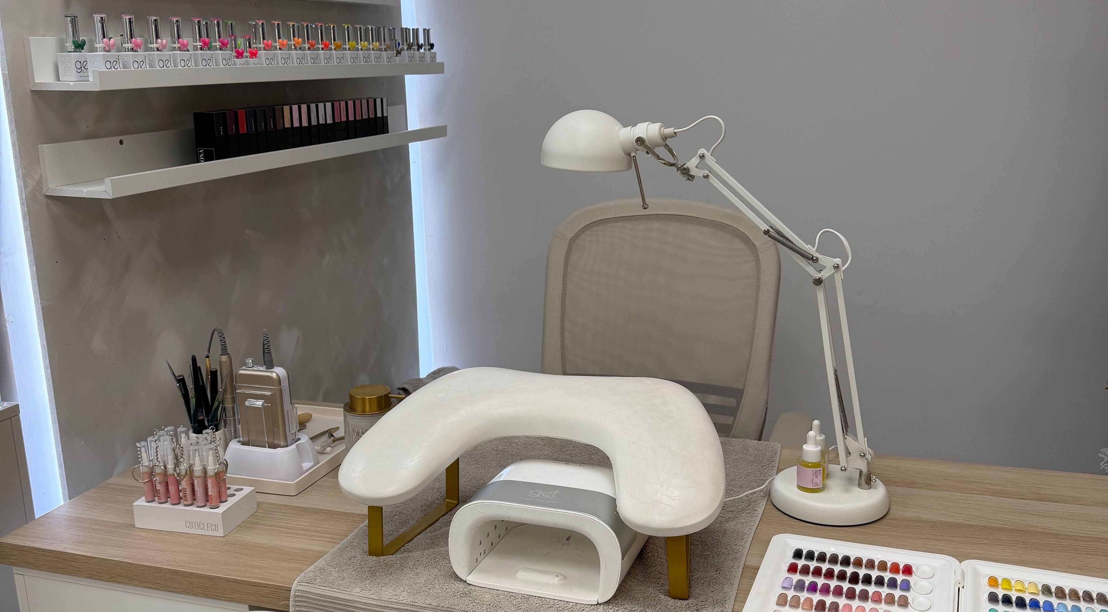 Nail station at Glossy by Nieve, Hartlepool, England, GB, featuring gel polishes and manicure tools.