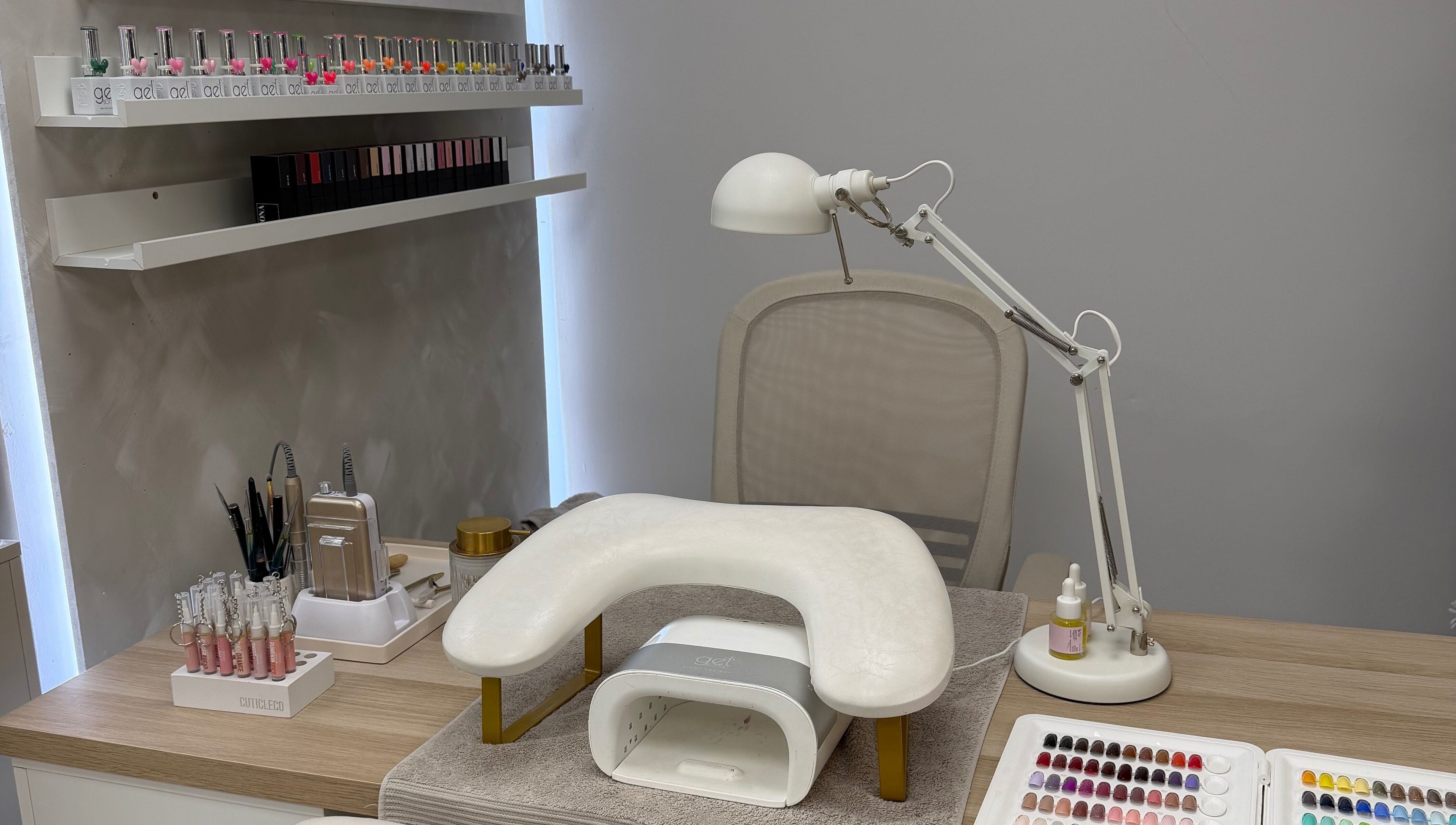 Modern nail station at Glossy by Nieve, Hartlepool, England, GB, featuring polish and tools.