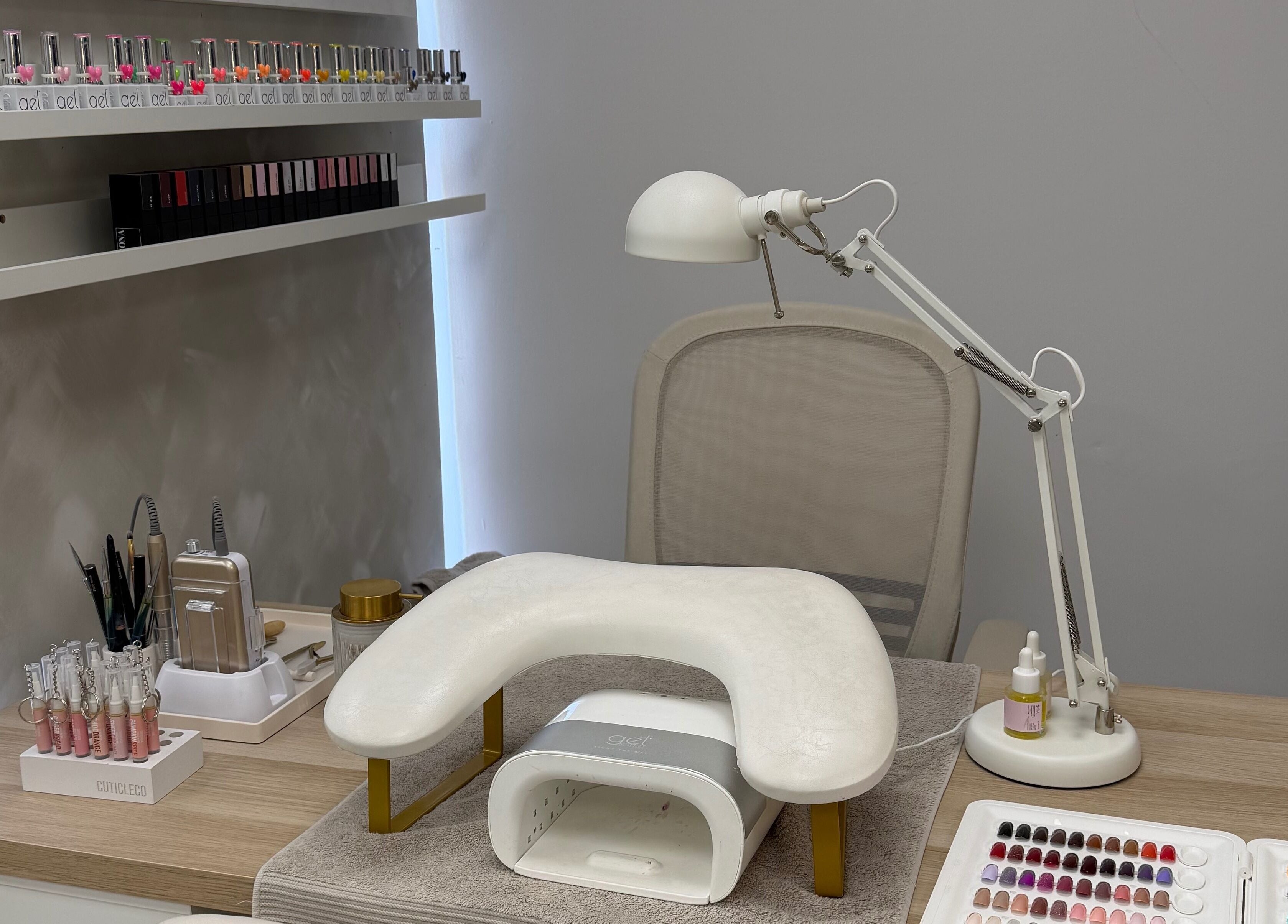 Modern nail station at Glossy by Nieve, Hartlepool, England, GB, featuring polish and tools.