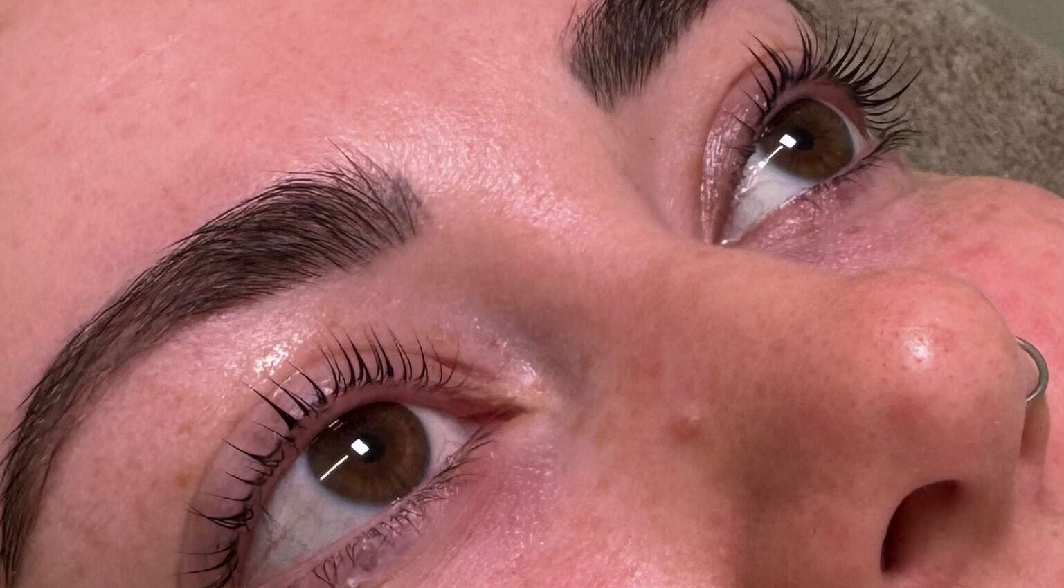 Close-up of perfectly shaped eyebrows and lashes at Glossy by Nieve, Hartlepool, England, GB.