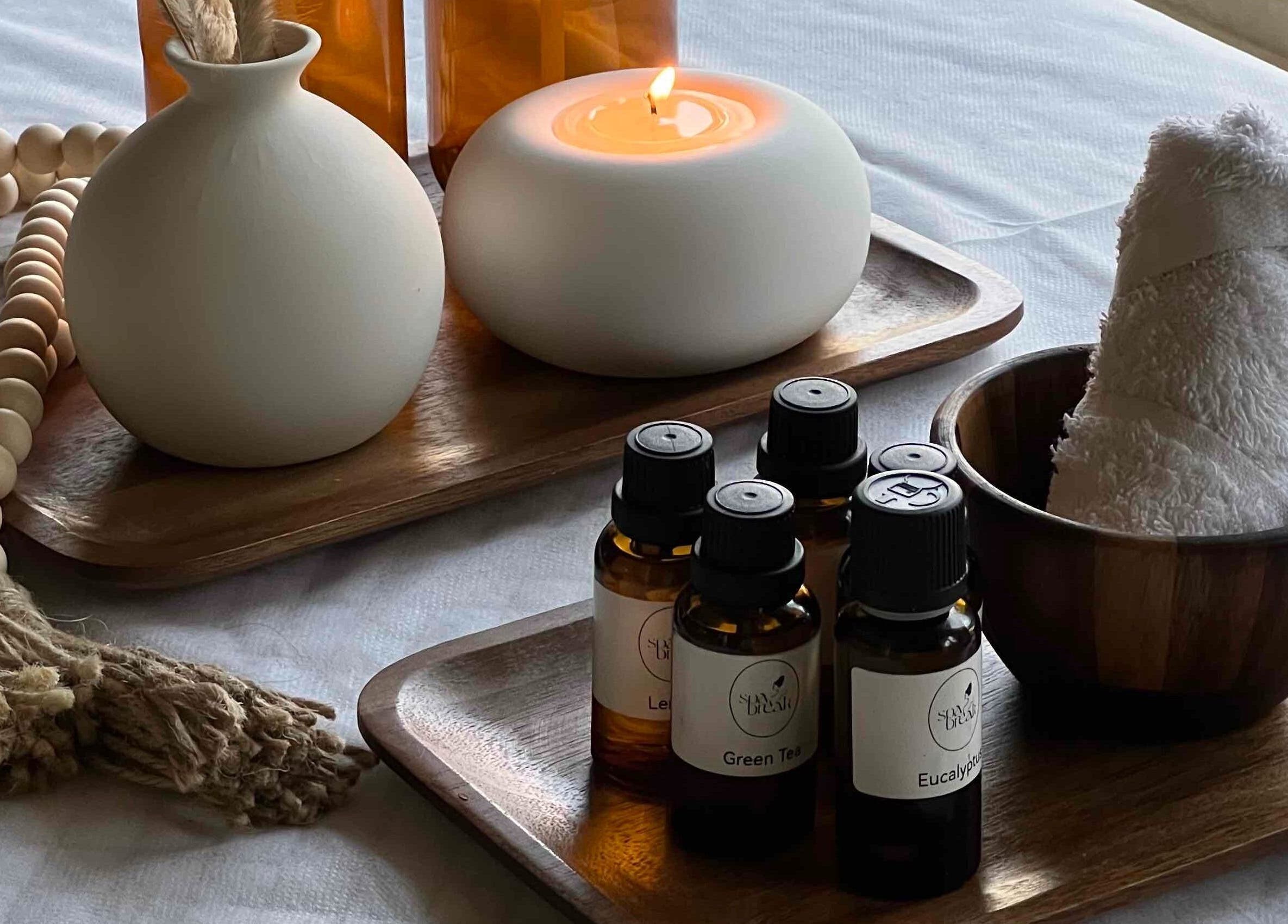 Aromatherapy setup at Spa Break - Home Service, Riyadh, Riyadh Province, SA with oils, candle, and towel.