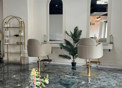 Elegant salon chairs at Lewa Studios, Birmingham, England, GB, showcasing modern beauty space.