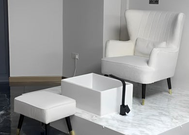 Elegant pedicure chair setup at Lewa Studios, Birmingham, England, GB, highlighting luxury and comfort.