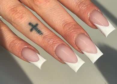 Elegant French manicure with tattoo at Lewa Studios, Birmingham, England, GB.