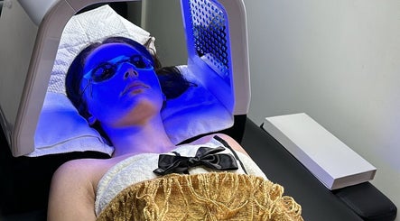 A client enjoys a blue light therapy session at Dermal glowz in Punchbowl, New South Wales, AU.