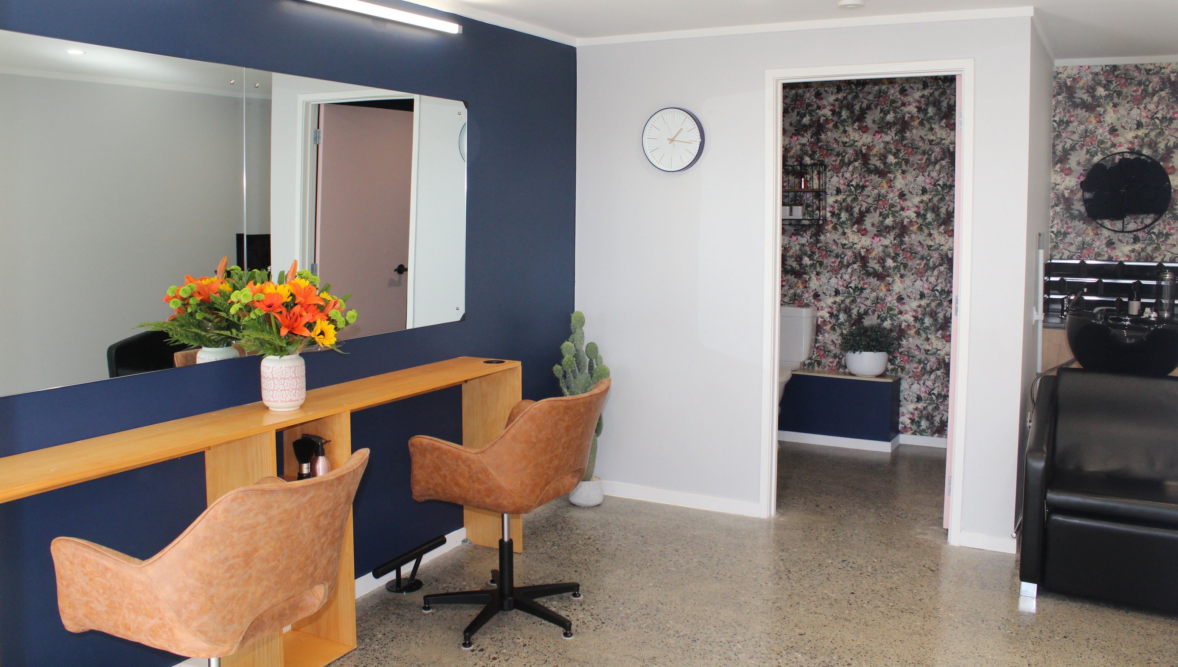 Chic salon setup at The Ginger Fox in Morrinsville, Waikato, NZ with stylish decor and seating.