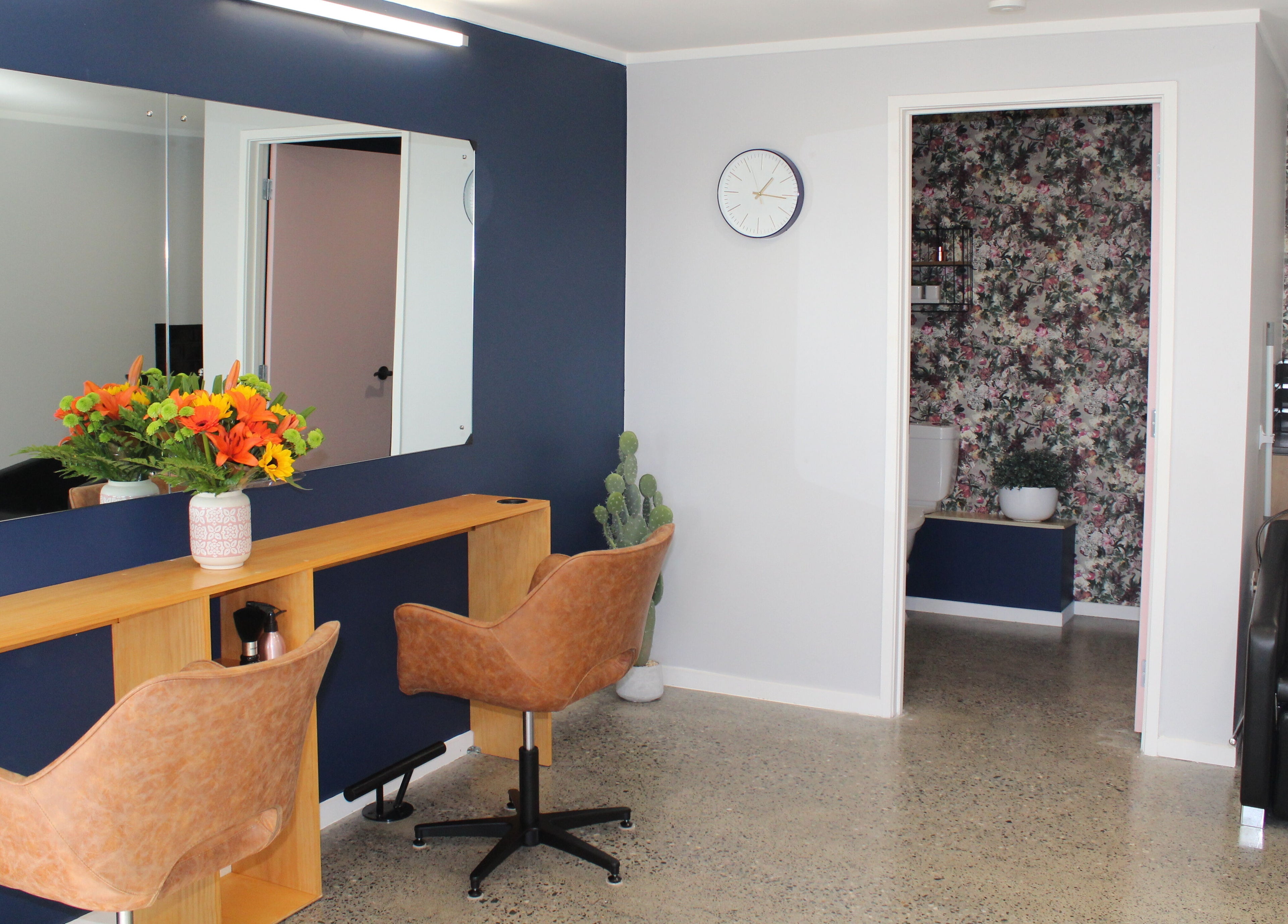 Chic salon setup at The Ginger Fox in Morrinsville, Waikato, NZ with stylish decor and seating.